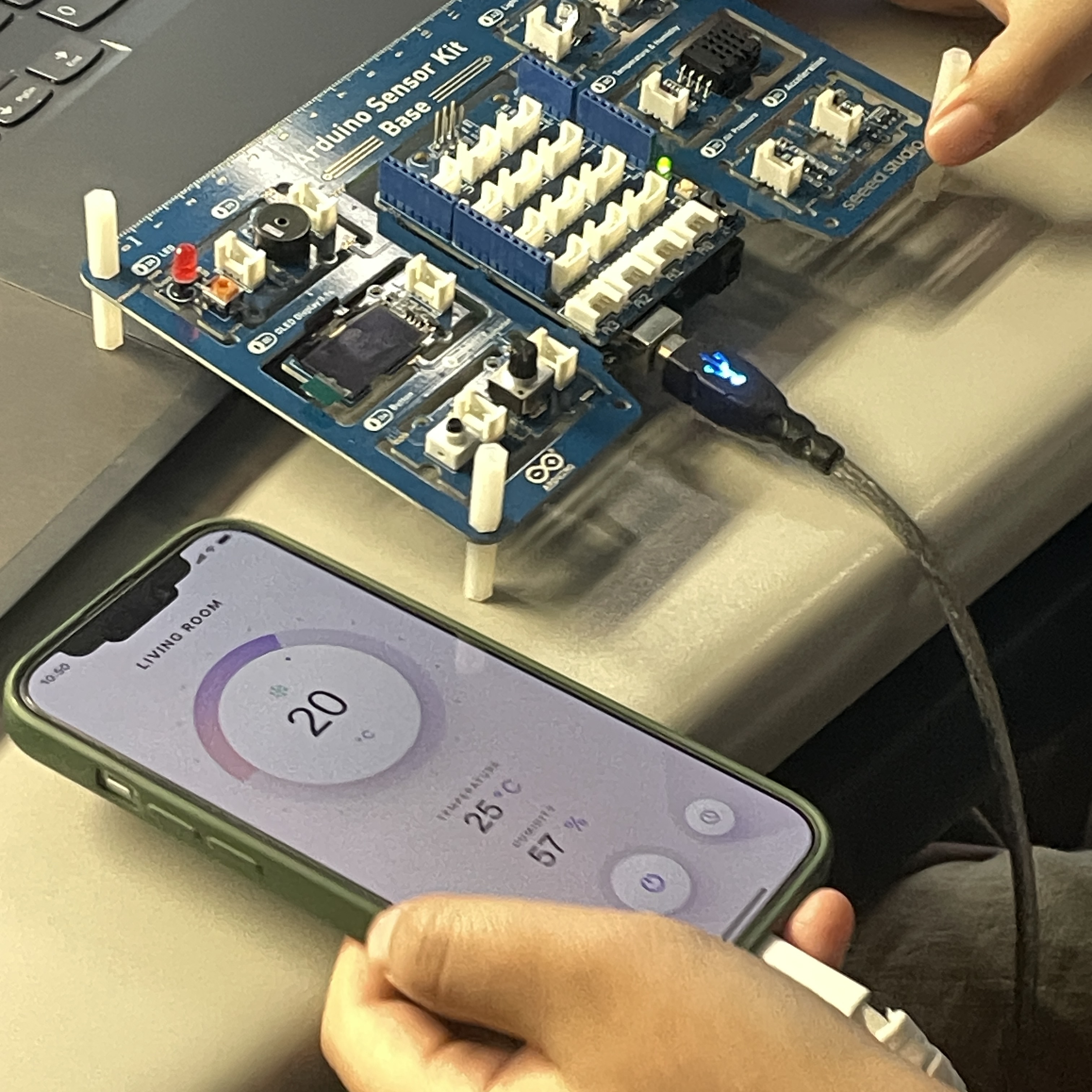 Connecting the phone to the lap top to display the data collected by the Arduino sensor kit as a simple software interface.