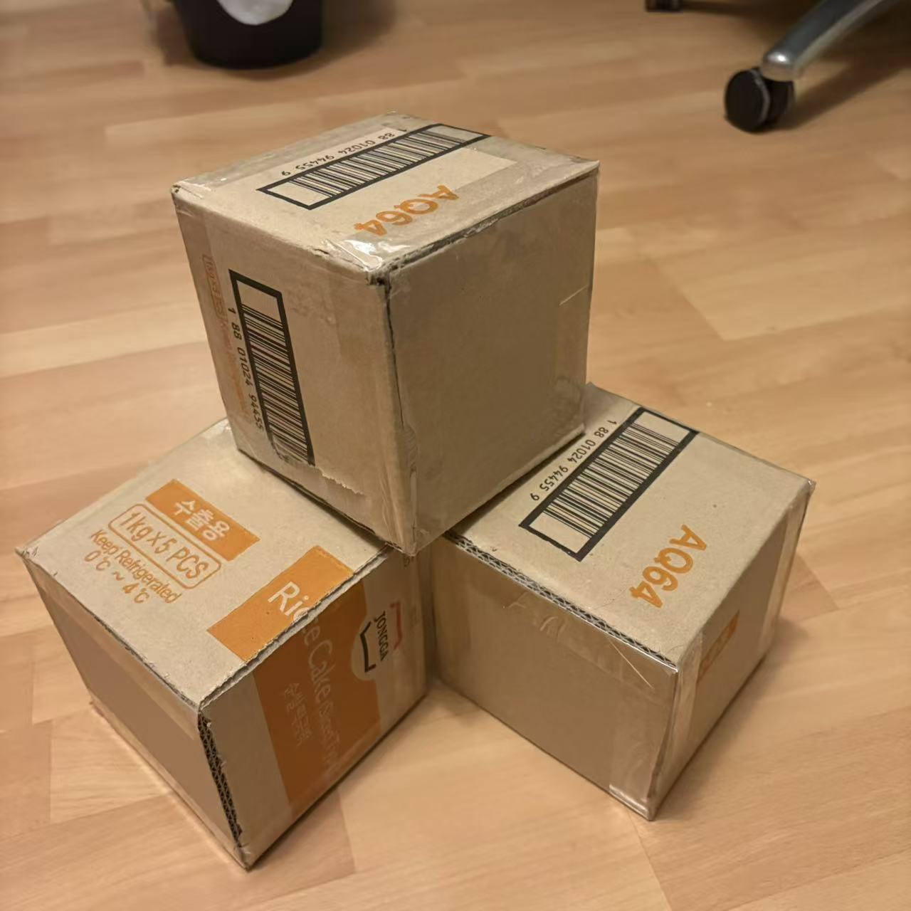 Three cubes cut from shipping cardboard boxes will be used to project images onto their surfaces.