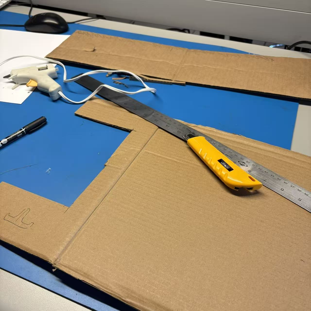 These are the main tools needed to make a cardboard phone stand.